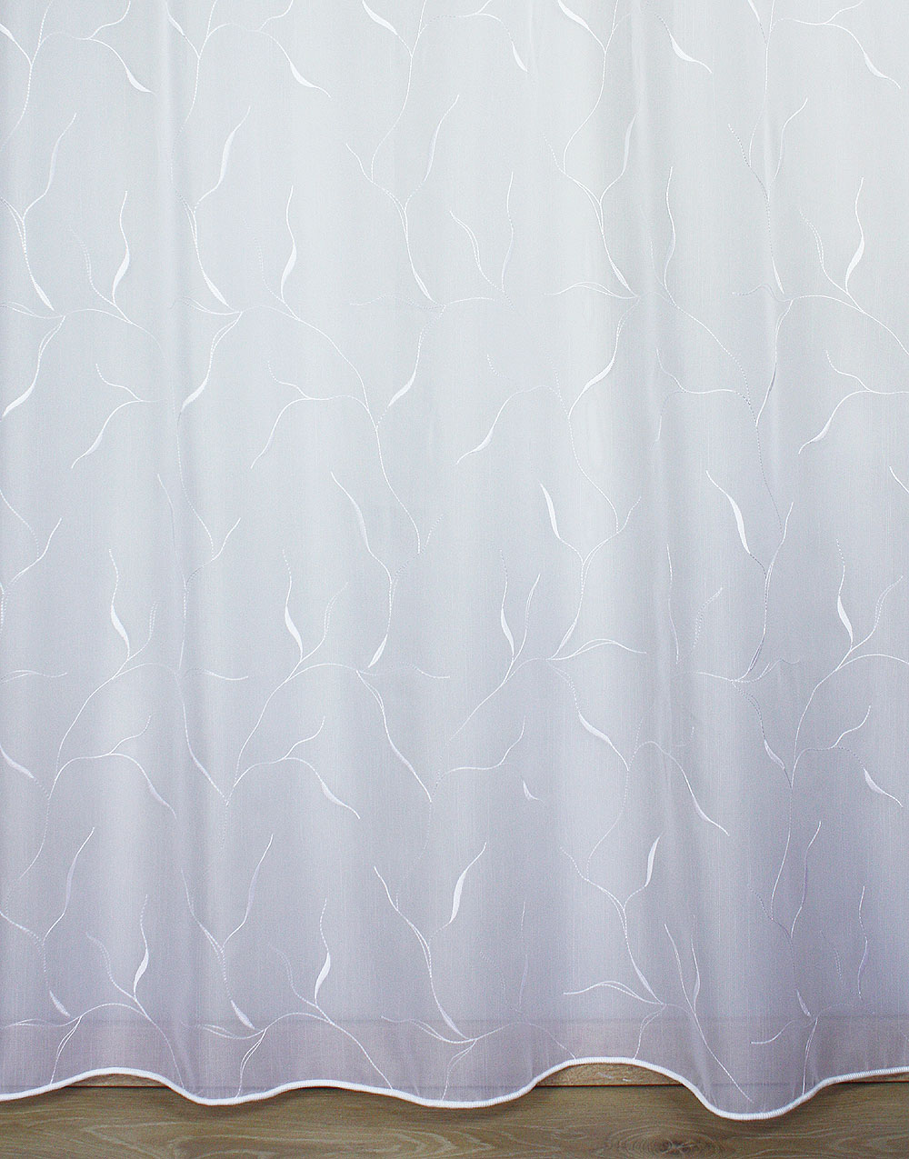 Sheer curtain with white embroidery